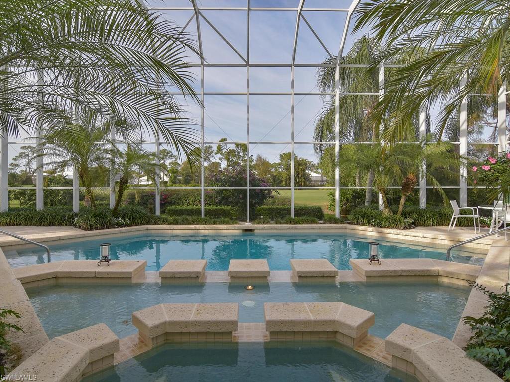 771 Brentwood Point Naples, FL 34110 - Photo 26 of 31 a view of a swimming pool with a patio