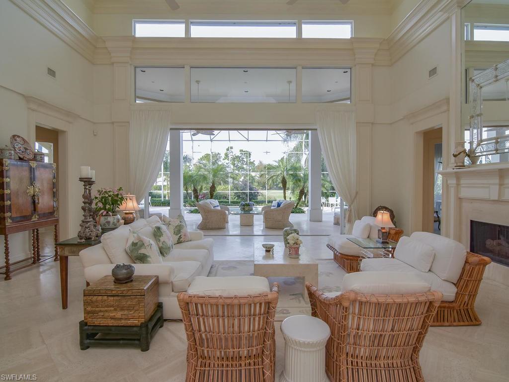 771 Brentwood Point Naples, FL 34110 - Photo 5 of 31 a living room with furniture and a large window