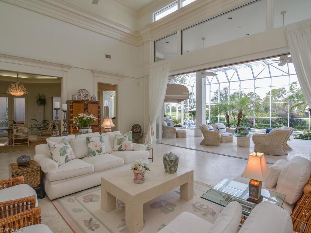 771 Brentwood Point Naples, FL 34110 - Photo 7 of 31 a living room with furniture and a large window