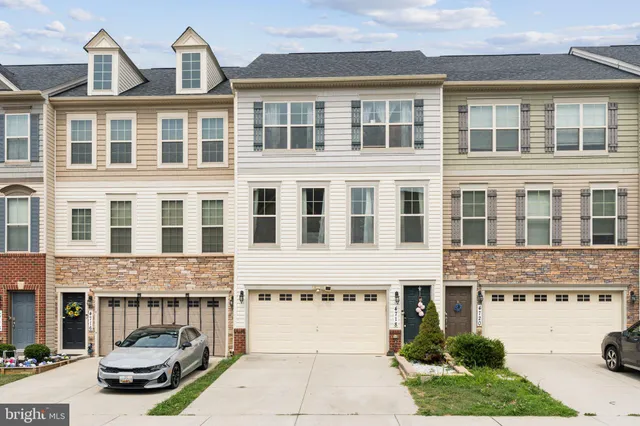 a front view of a building with parking space