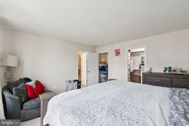 a bed room with a bed and a mirror