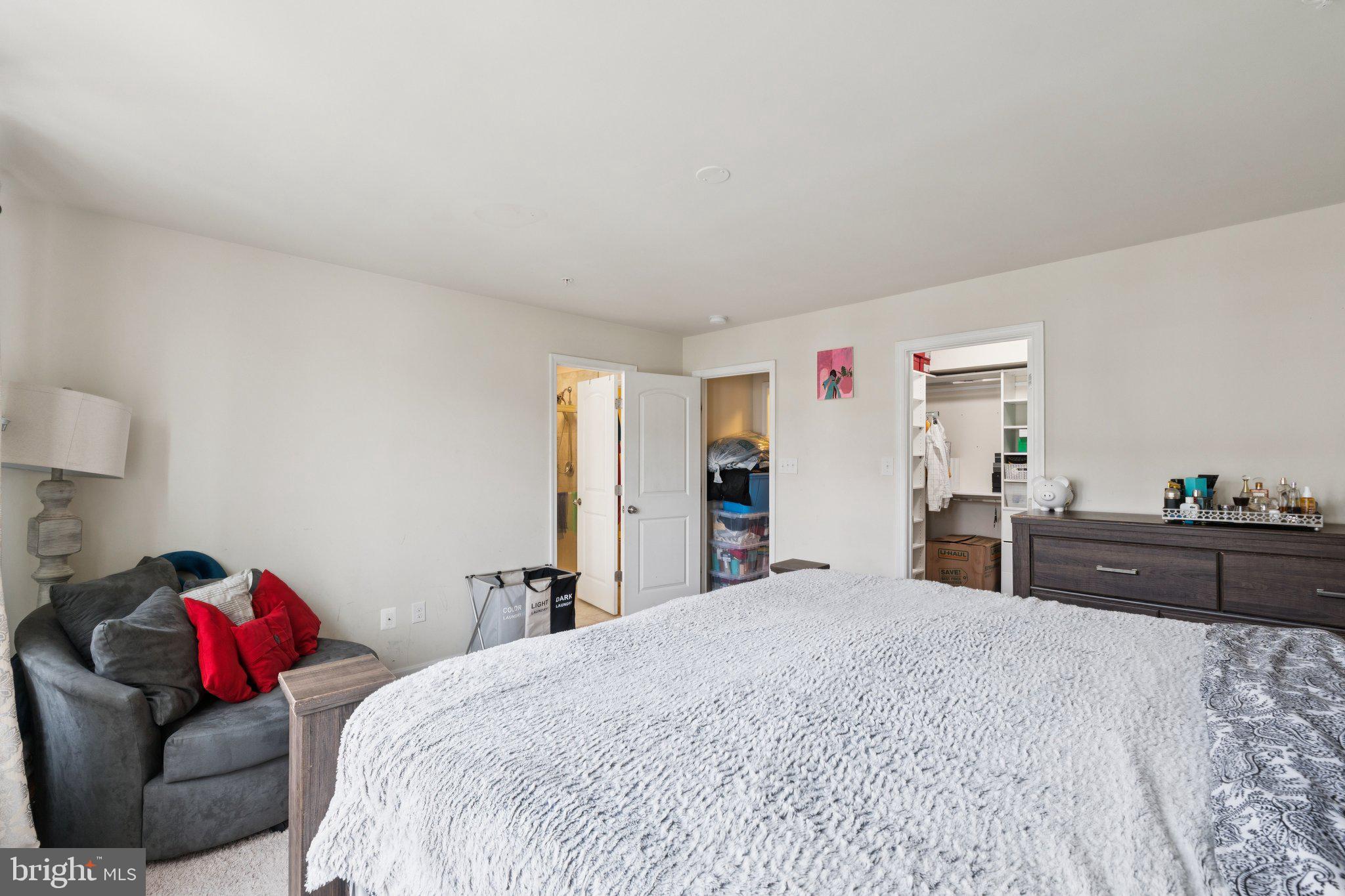 4718 Cambria Road Frederick, MD 21703 - Photo 13 of 32 a bed room with a bed and a mirror