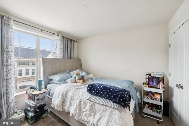 a bedroom with a bed and a book shelf