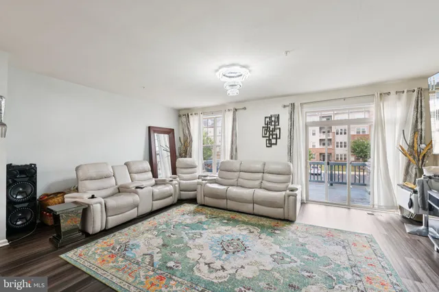 a living room with furniture lamp and rug