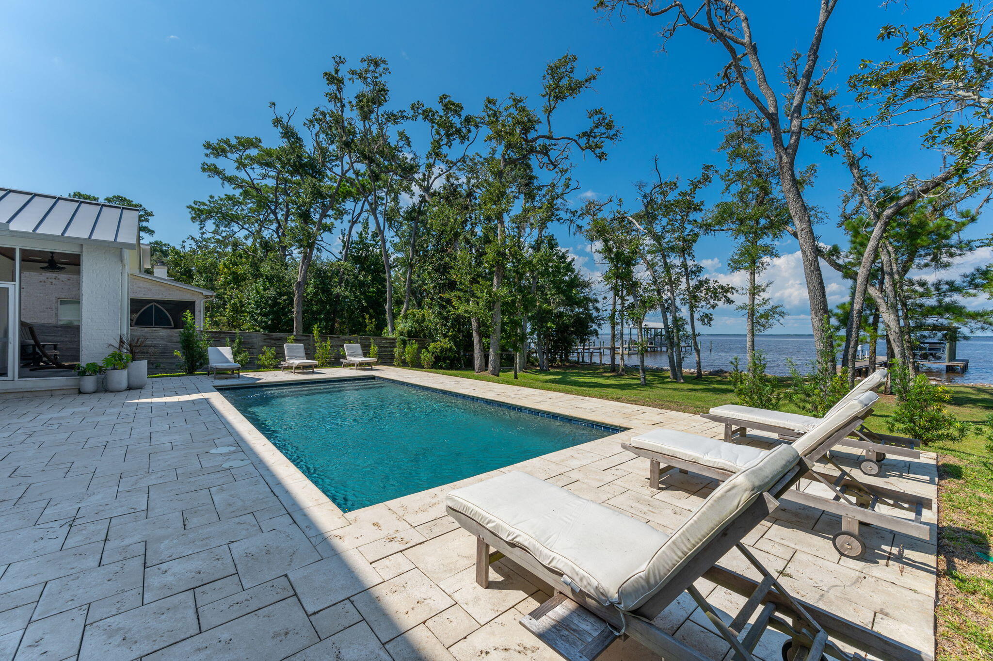 164 Bay Trace Santa Rosa Beach, FL 32459 - Photo 13 of 90 a view of a swimming pool with a patio and a yard