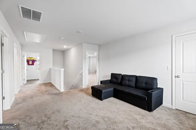 a bed room with a bed and a television