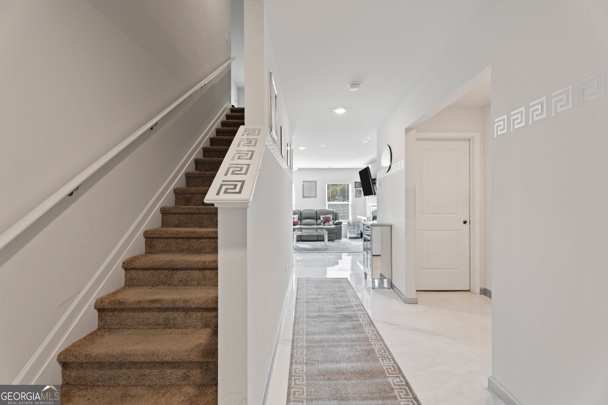 321 Kirt's Ridge Jackson, GA 30233 - Photo 2 of 57 a view of a hallway with wooden floor and staircase