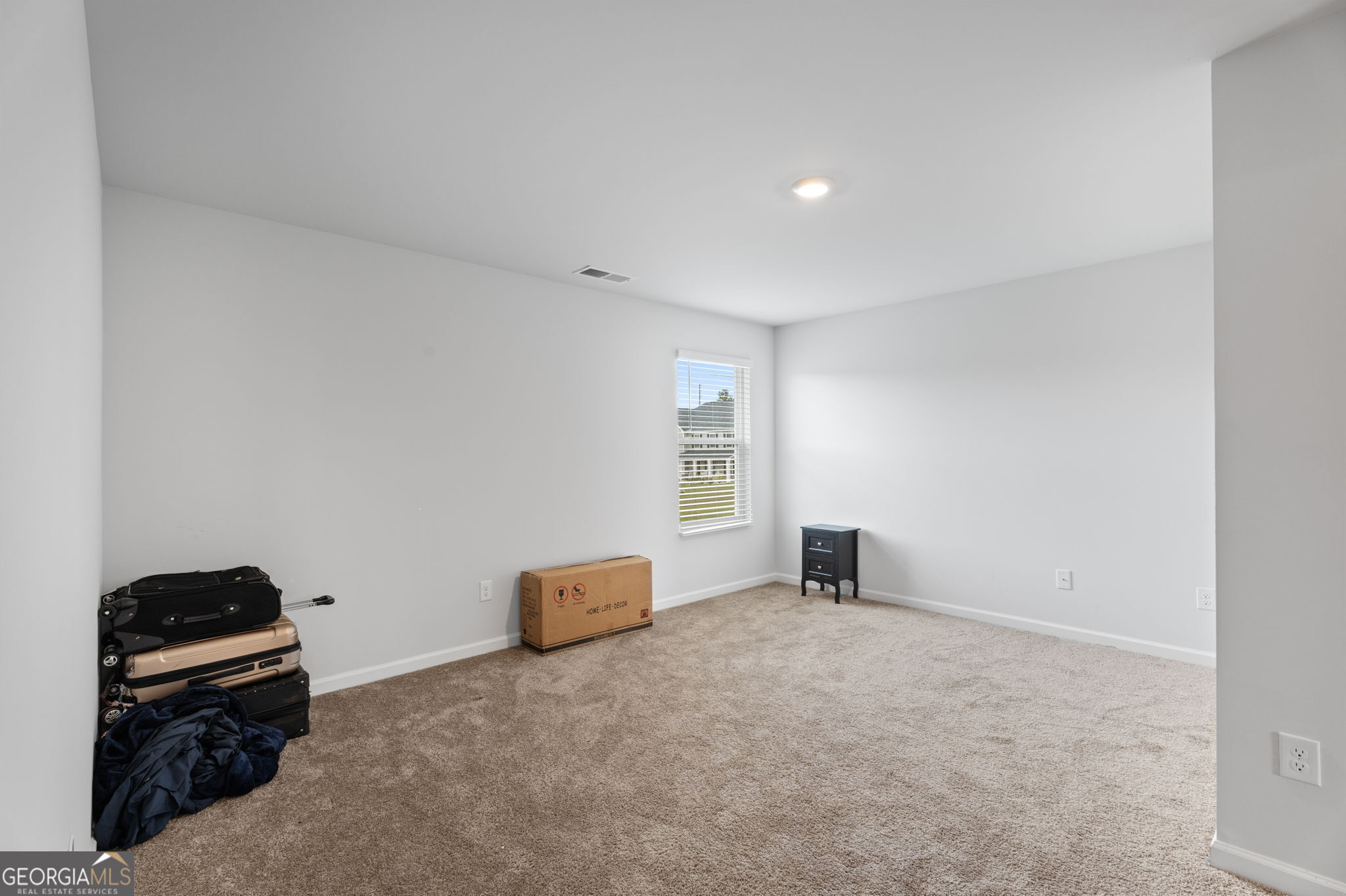 321 Kirt's Ridge Jackson, GA 30233 - Photo 37 of 57 a bedroom with a bed and a window