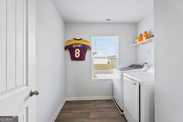 a bathroom with a toilet and a shower curtain