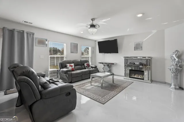 a kitchen with kitchen island a appliances dining table and chairs