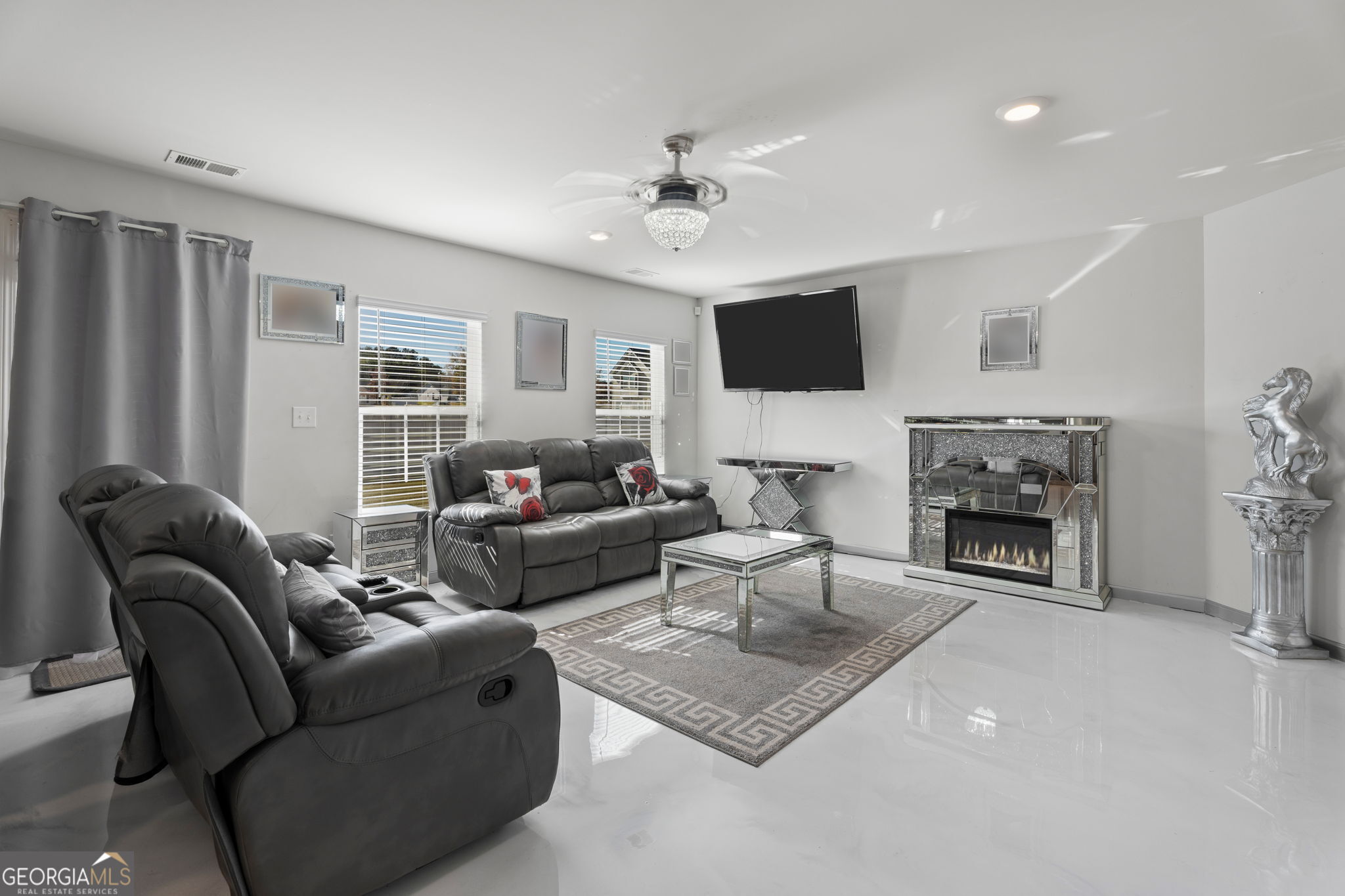 321 Kirt's Ridge Jackson, GA 30233 - Photo 6 of 57 a living room with furniture a fireplace and a flat screen tv