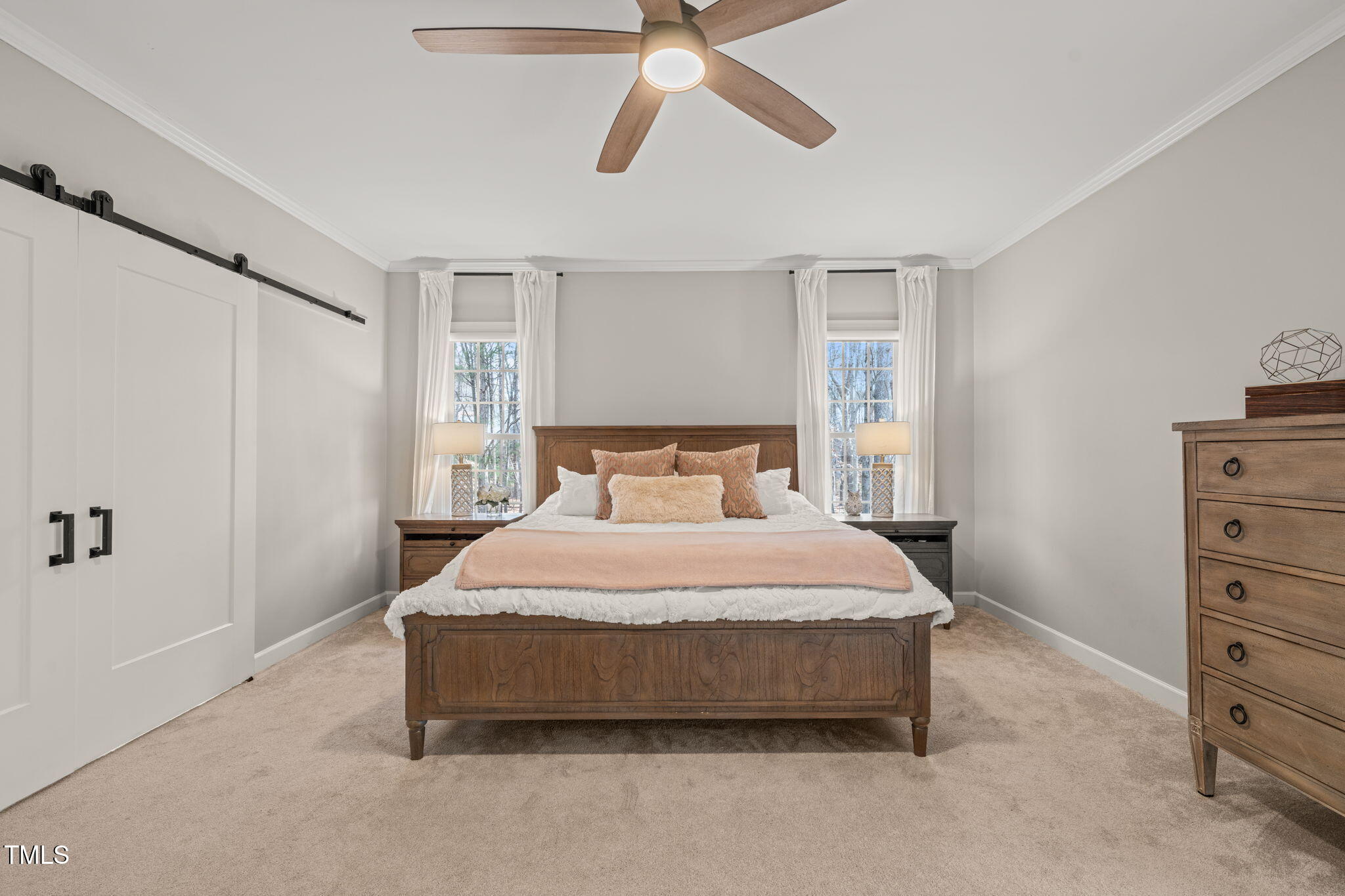 5032 Big Creek Road Raleigh, NC 27613 - Photo 16 of 46 a bedroom with a bed and a cabinets
