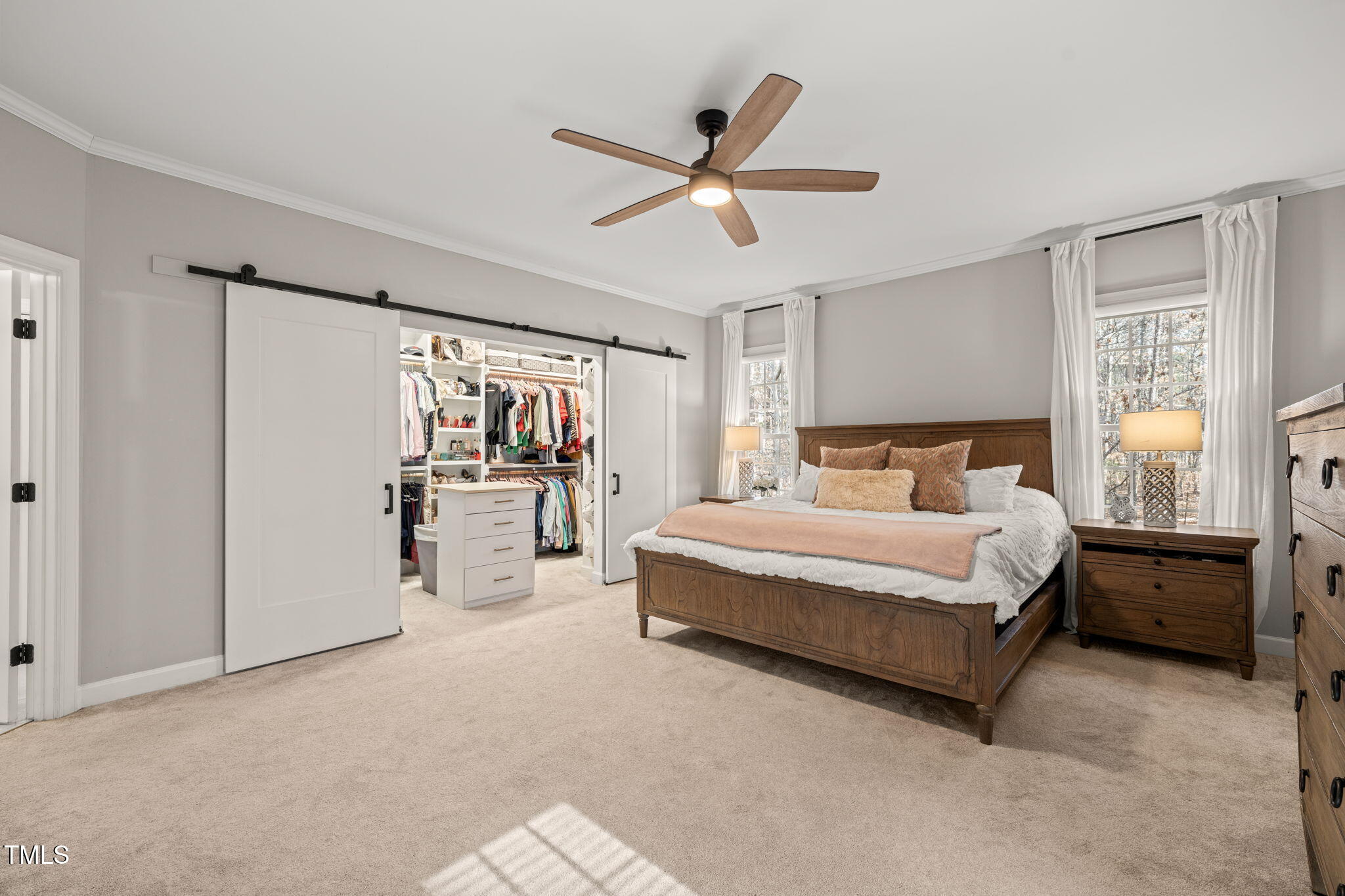 5032 Big Creek Road Raleigh, NC 27613 - Photo 17 of 46 a bedroom with a bed and large window
