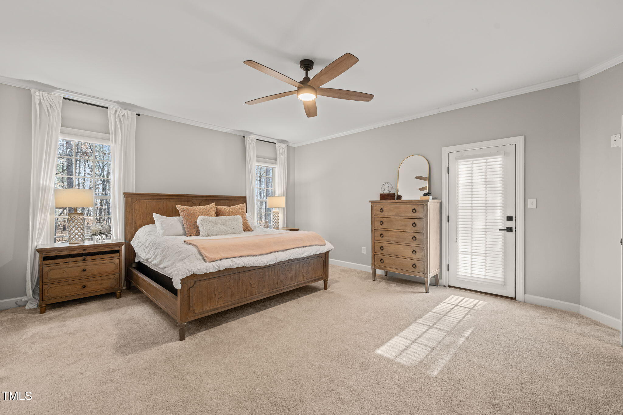 5032 Big Creek Road Raleigh, NC 27613 - Photo 18 of 46 a spacious bedroom with a bed and window