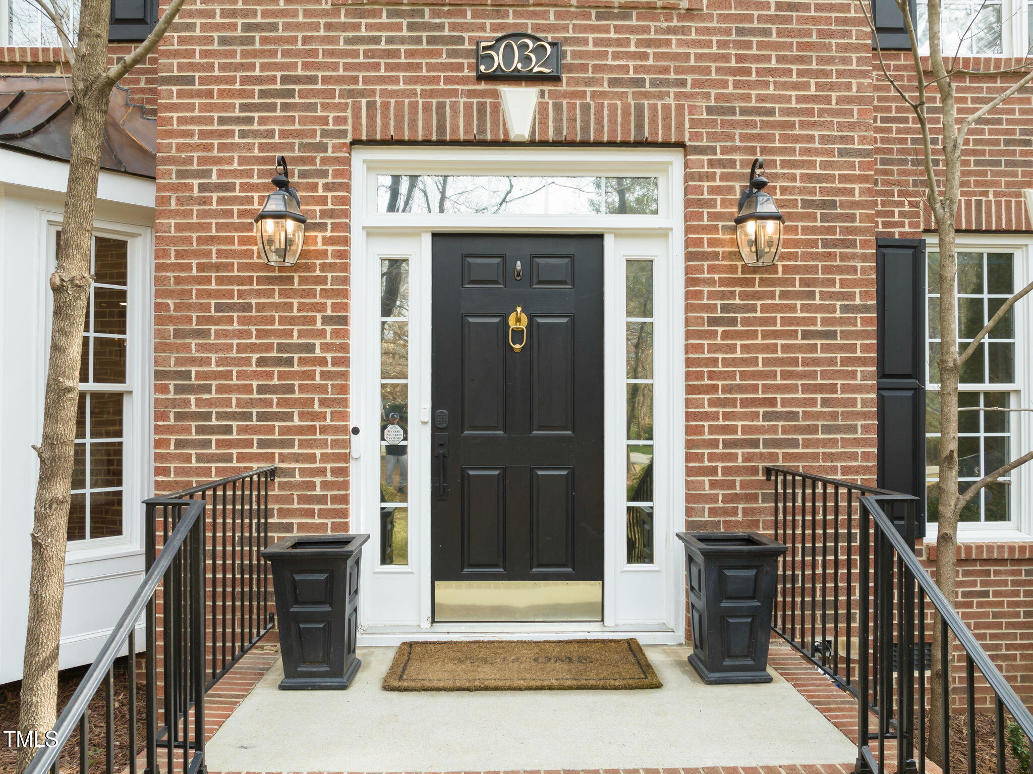 5032 Big Creek Road Raleigh, NC 27613 - Photo 2 of 46 a front view of a building with a door