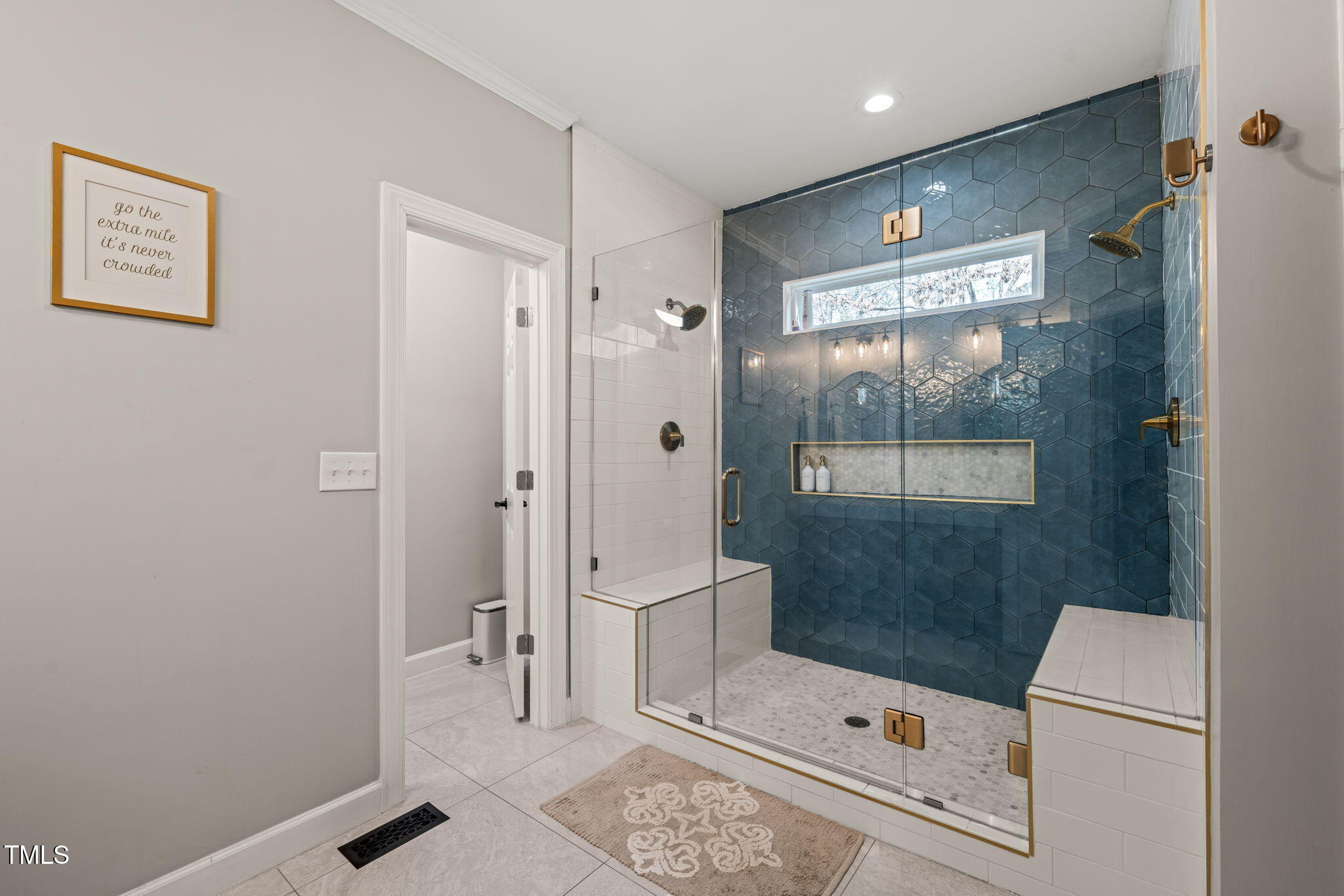 5032 Big Creek Road Raleigh, NC 27613 - Photo 22 of 46 a bathroom with a shower and a toilet