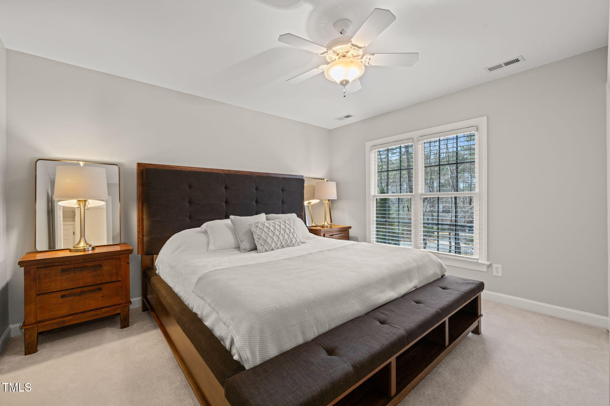 5032 Big Creek Road Raleigh, NC 27613 - Photo 27 of 46 a bedroom with a bed dresser and a window