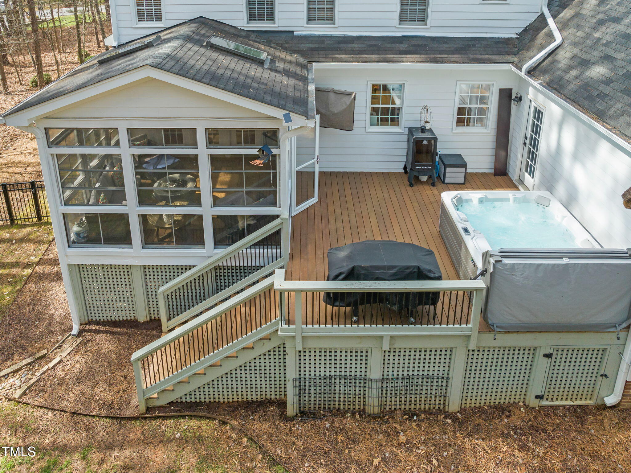 5032 Big Creek Road Raleigh, NC 27613 - Photo 40 of 46 a view of a house with a balcony and door