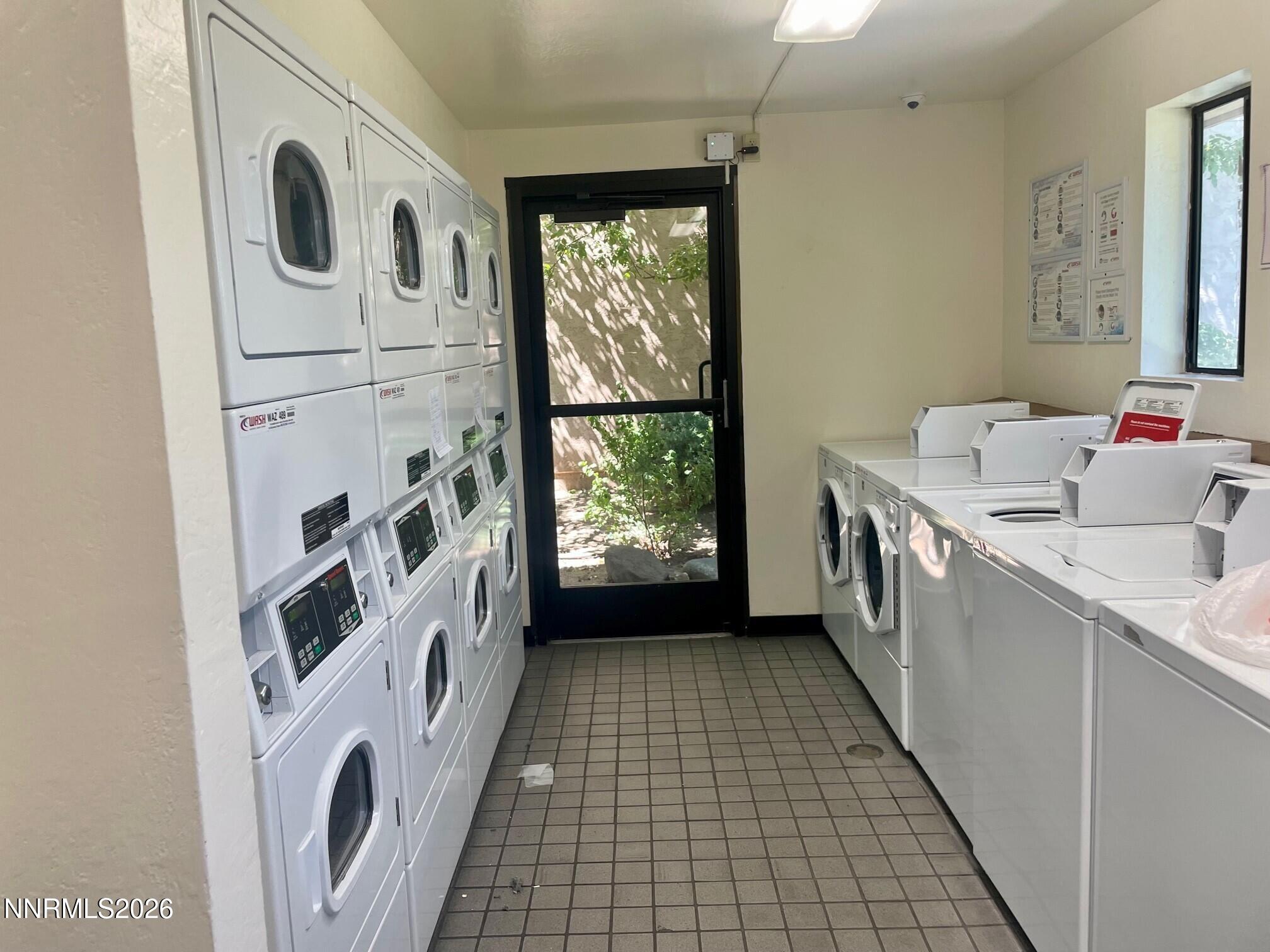 2955 Lakeside Drive, Unit 120 Reno, NV 89509 - Photo 18 of 21 a bathroom with a bathtub sink a washer and dryer