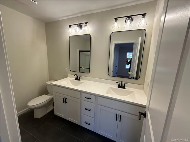 a bathroom with a sink and toilet