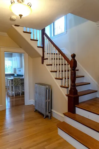 a kitchen with stainless steel appliances granite countertop a stove refrigerator and microwave