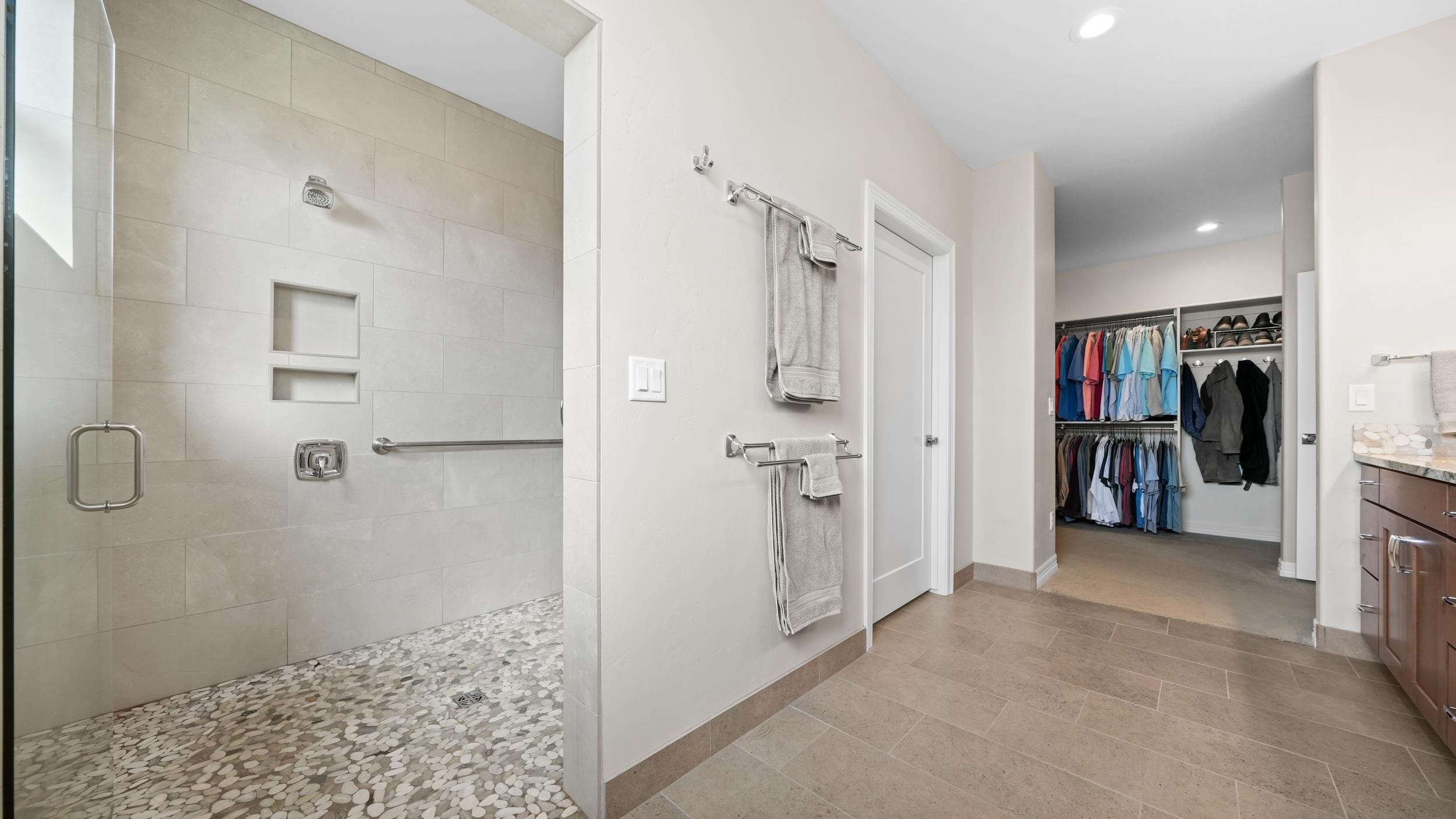1295 Eagle Way Fruita, CO 81521 - Photo 14 of 36 a view of a bathroom with a shower and a sink