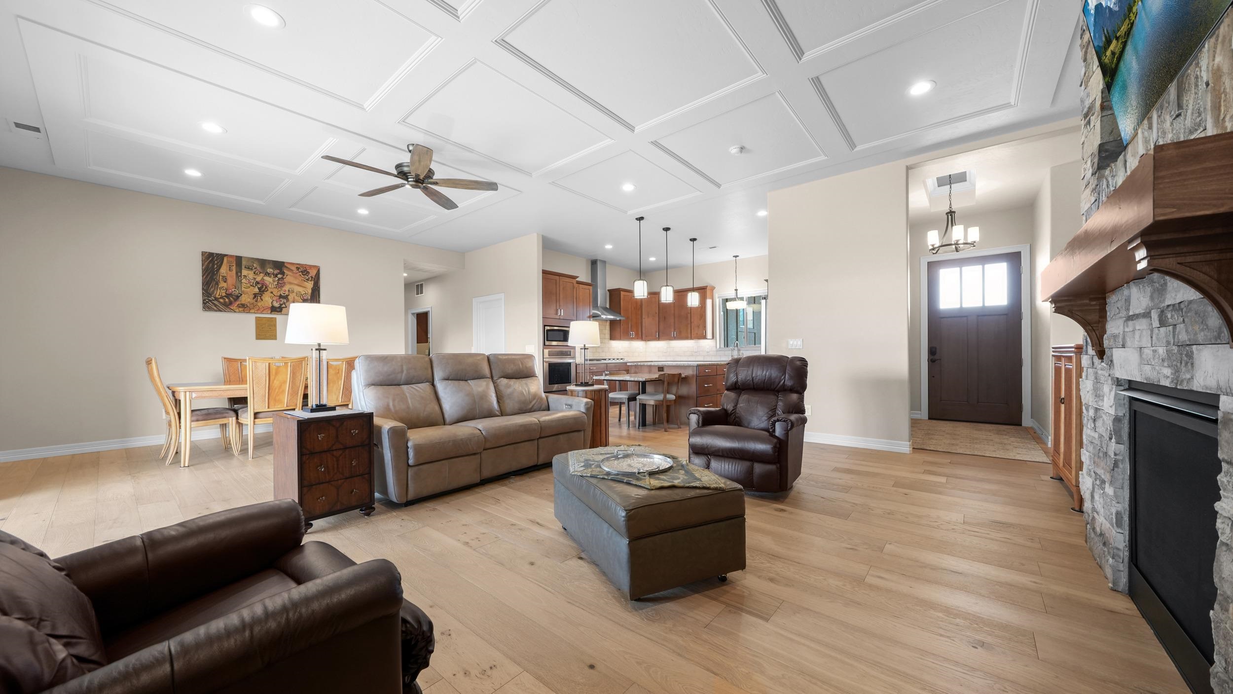 1295 Eagle Way Fruita, CO 81521 - Photo 2 of 36 a living room with fireplace furniture and a wooden floor
