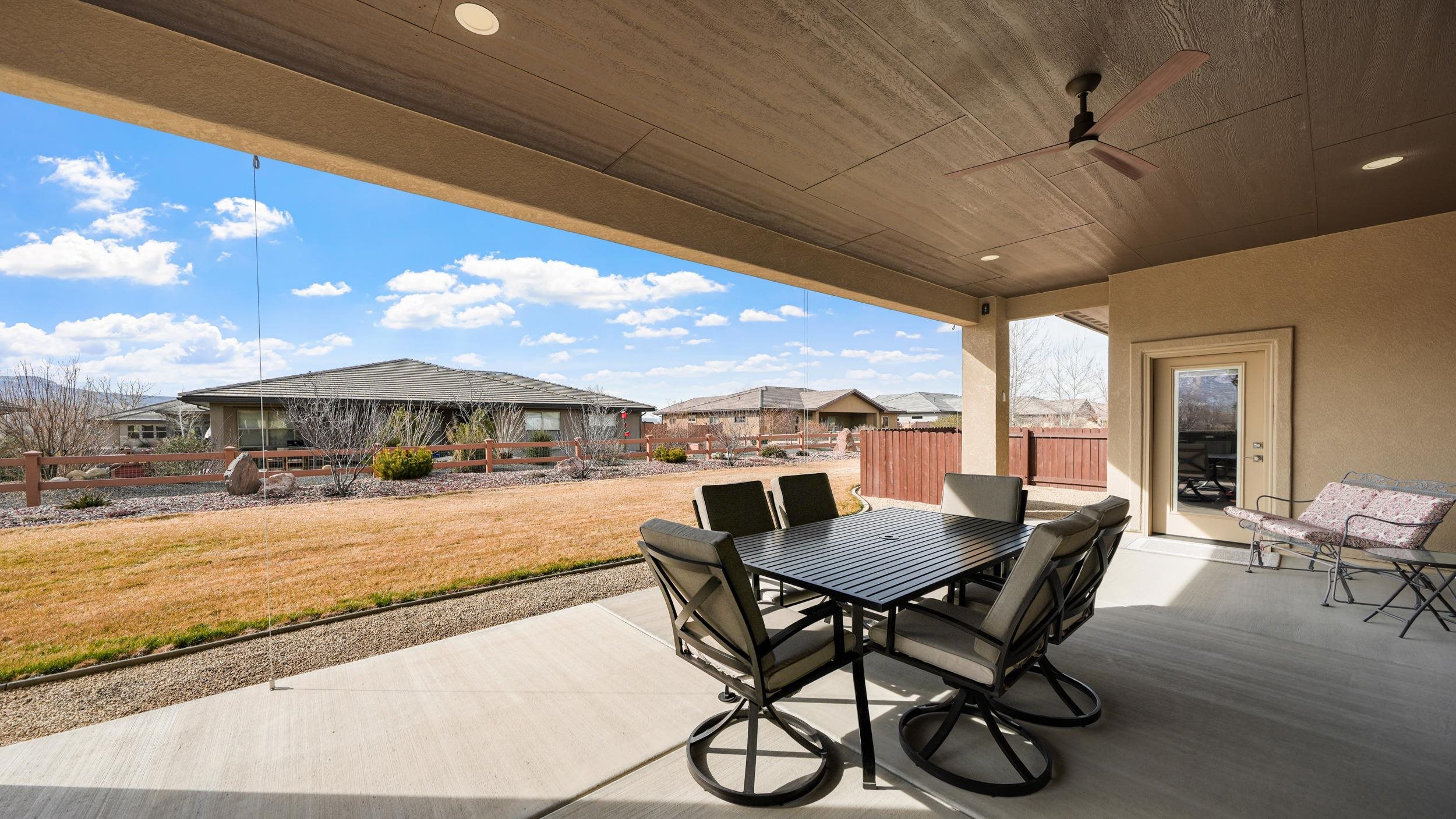 1295 Eagle Way Fruita, CO 81521 - Photo 23 of 36 a view of a patio with a table and chairs