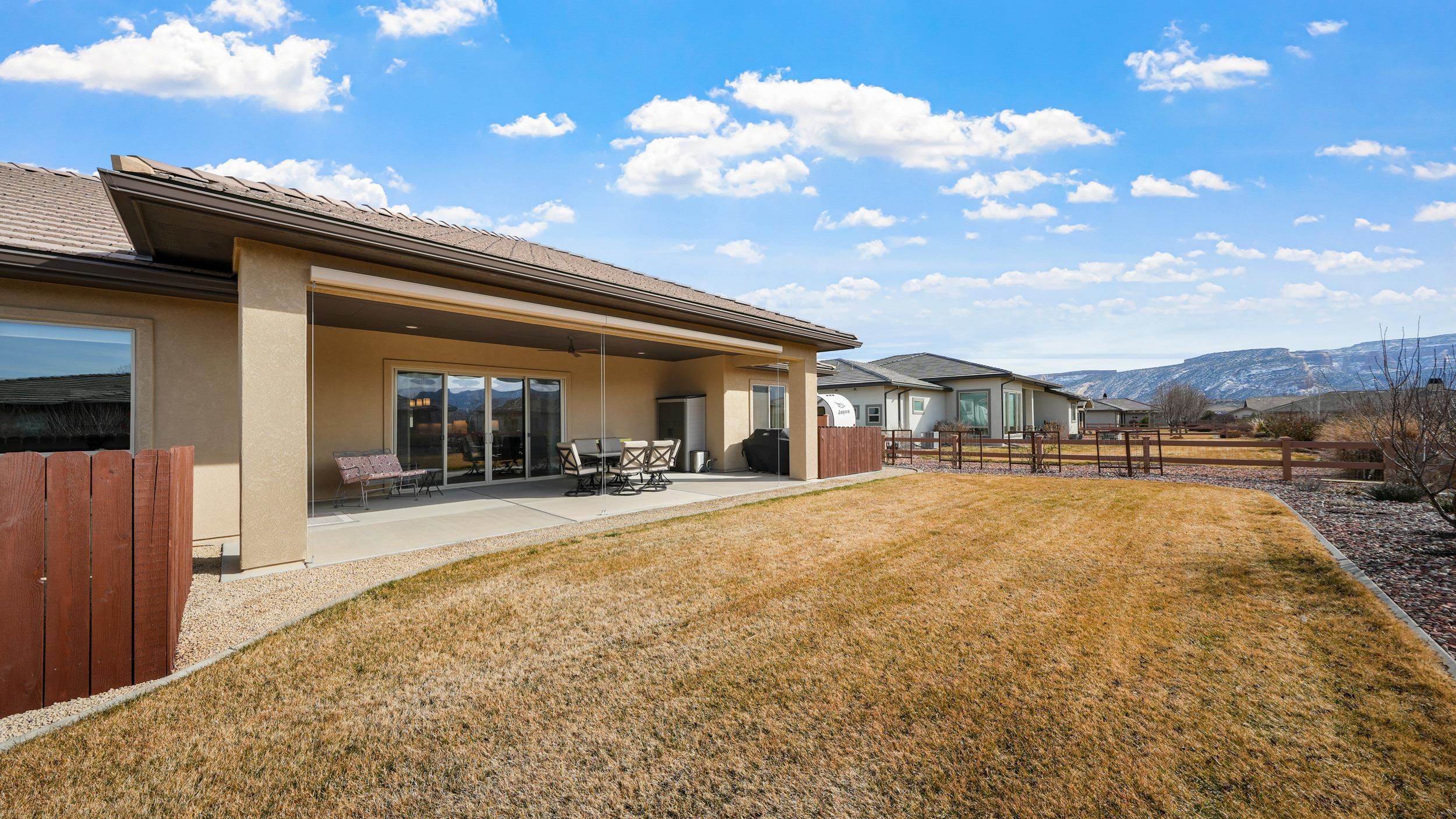 1295 Eagle Way Fruita, CO 81521 - Photo 25 of 36 a view of a house with tub and porch