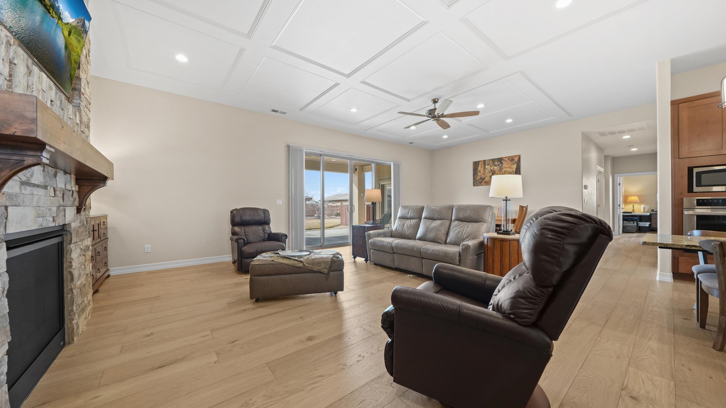 1295 Eagle Way Fruita, CO 81521 - Photo 3 of 36 a living room with furniture and a fireplace