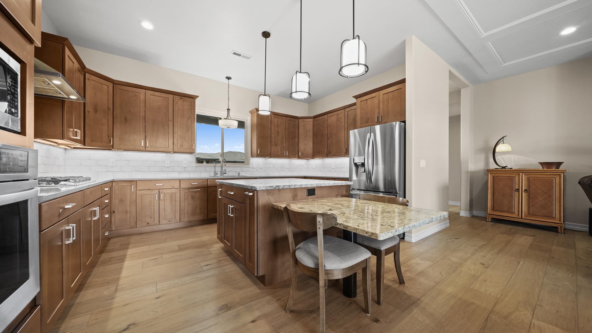 1295 Eagle Way Fruita, CO 81521 - Photo 9 of 36 a kitchen with granite countertop a sink appliances cabinets and furniture