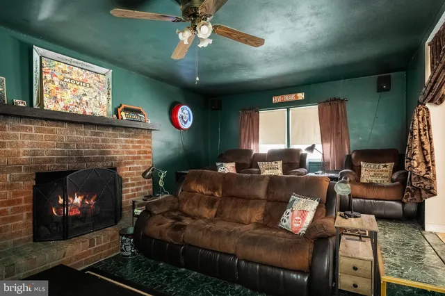 a view of a dining room with furniture wooden floor and chandelier
