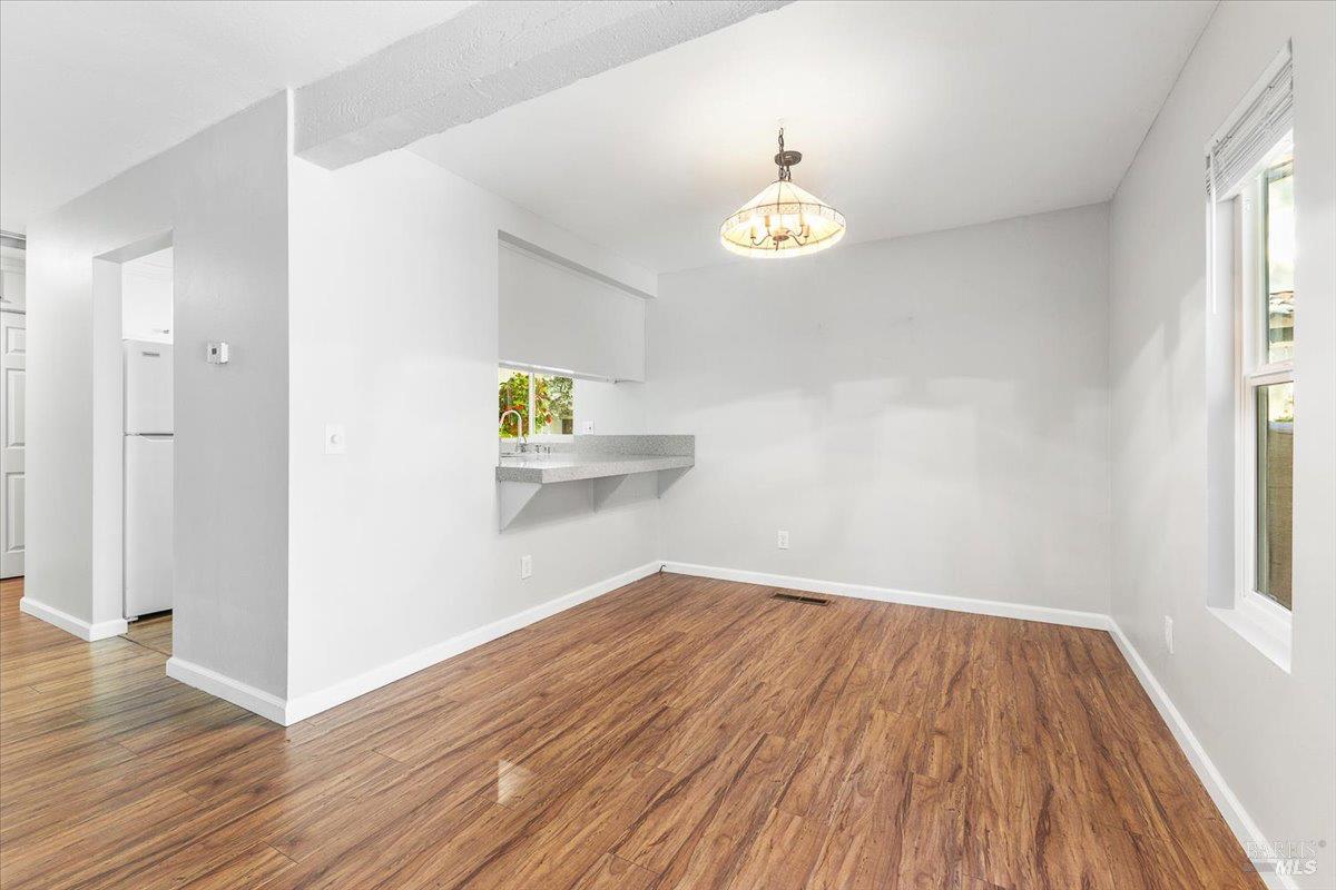 802 Adobe Drive Santa Rosa, CA 95404 - Photo 11 of 32 a view of empty room with wooden floor and window