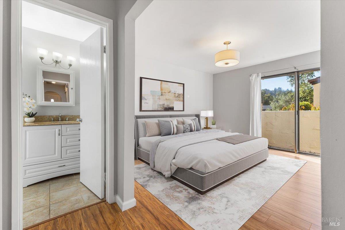 802 Adobe Drive Santa Rosa, CA 95404 - Photo 12 of 32 a bedroom with a bed and painting on the wall