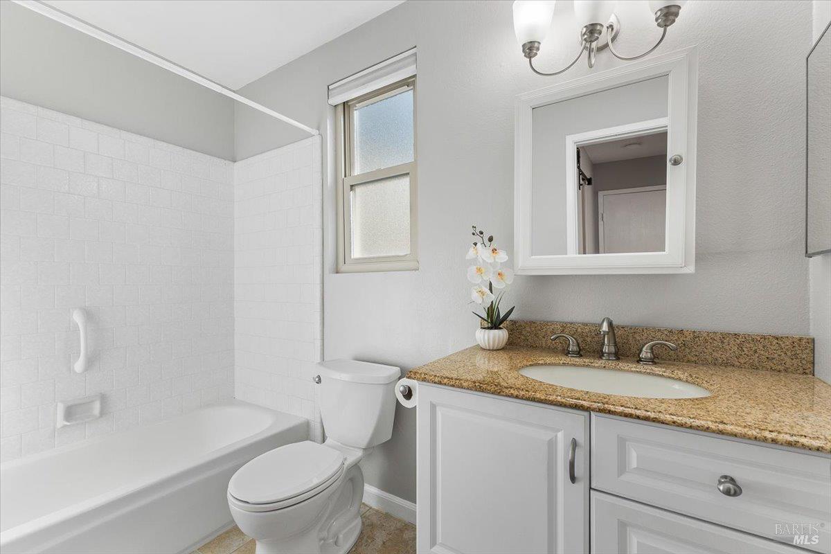 802 Adobe Drive Santa Rosa, CA 95404 - Photo 18 of 32 a bathroom with a granite countertop sink a toilet and shower