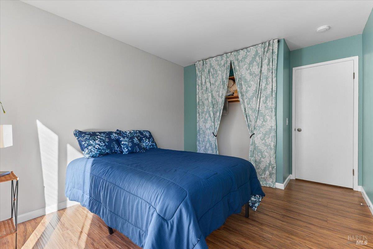 802 Adobe Drive Santa Rosa, CA 95404 - Photo 21 of 32 a bedroom with a bed and a painting on the wall