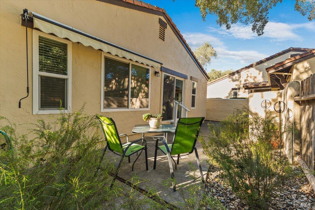 802 Adobe Drive Santa Rosa, CA 95404 - Photo 25 of 32 a view of a patio with table and chairs and potted plants