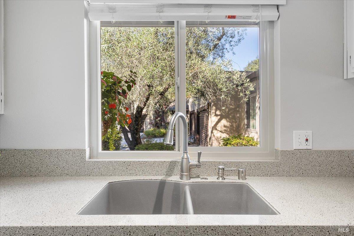 802 Adobe Drive Santa Rosa, CA 95404 - Photo 9 of 32 a bathroom with a tub a sink and a large window