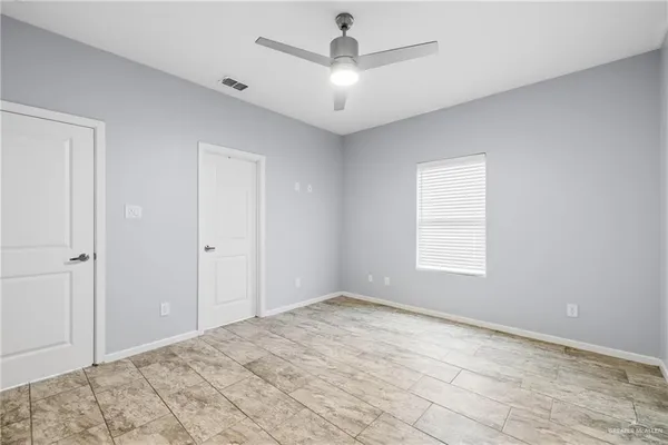 a view of an empty room and window