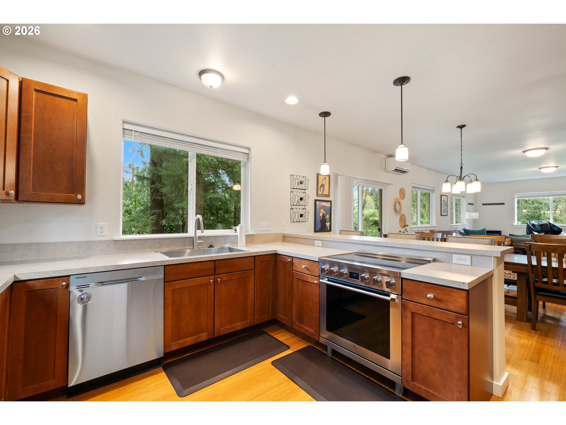 6040 Brickyard Road Tillamook, OR 97141 - Photo 13 of 41 a kitchen with stainless steel appliances granite countertop a stove a sink and a microwave