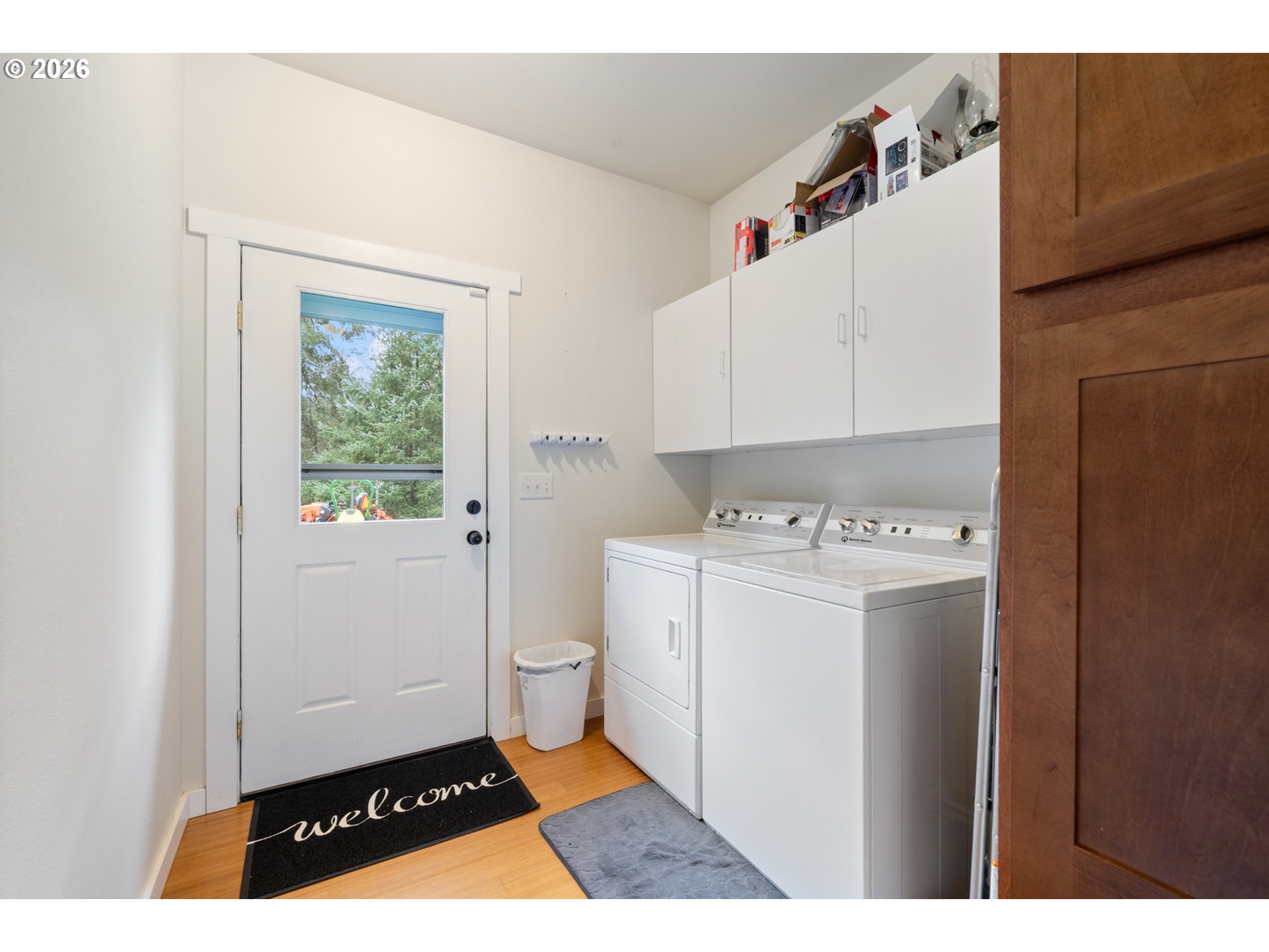 6040 Brickyard Road Tillamook, OR 97141 - Photo 21 of 41 a room with a washing machine and a sink