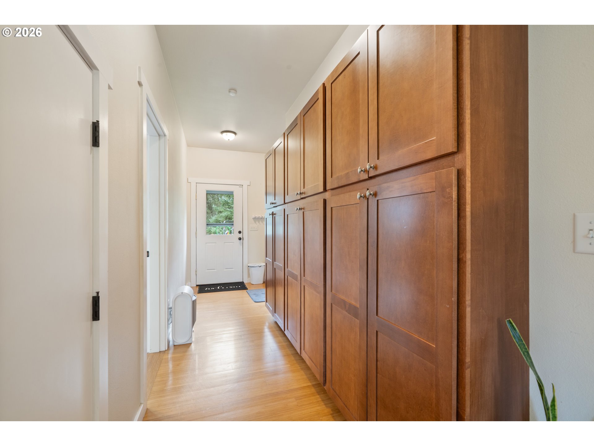 6040 Brickyard Road Tillamook, OR 97141 - Photo 22 of 41 a view of a hallway with wooden floors
