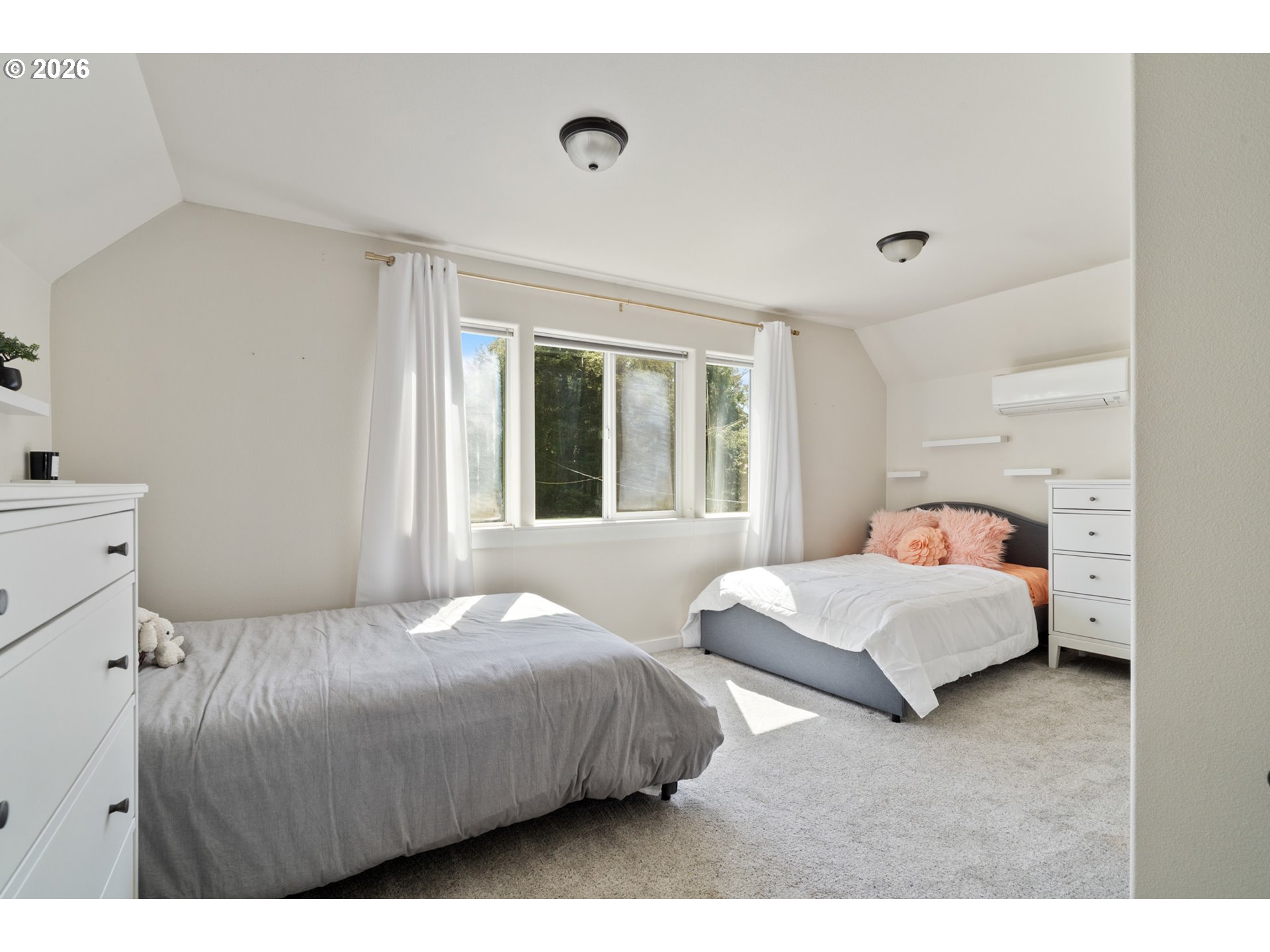 6040 Brickyard Road Tillamook, OR 97141 - Photo 23 of 41 a bedroom with two beds and a large window