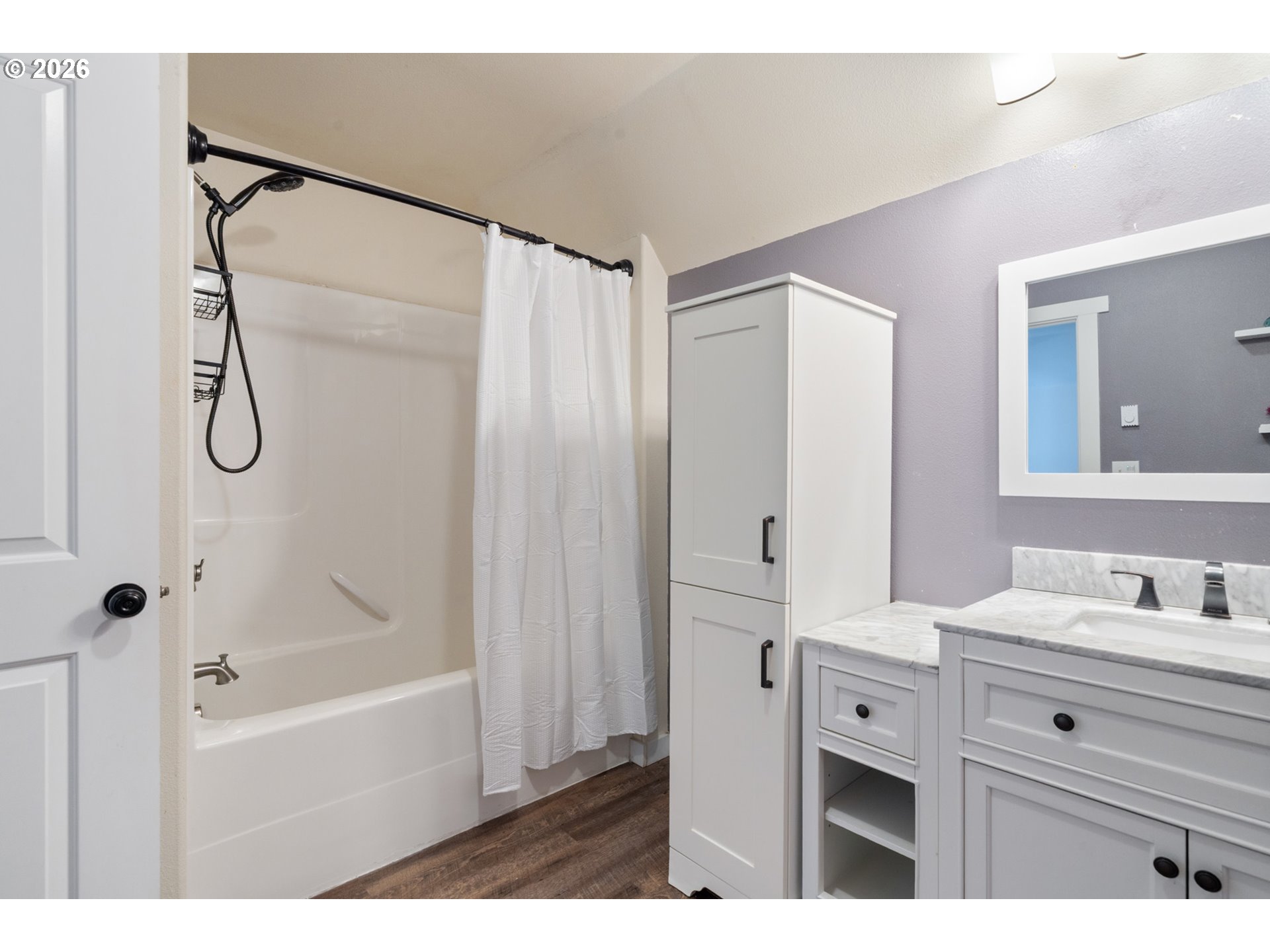6040 Brickyard Road Tillamook, OR 97141 - Photo 26 of 41 a bathroom with a tub sink vanity and mirror