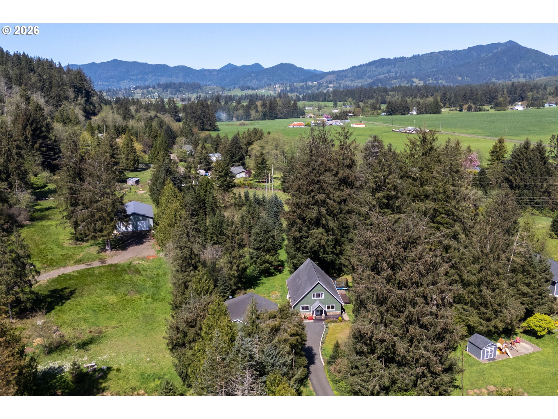 6040 Brickyard Road Tillamook, OR 97141 - Photo 3 of 41 a view of a city with mountain