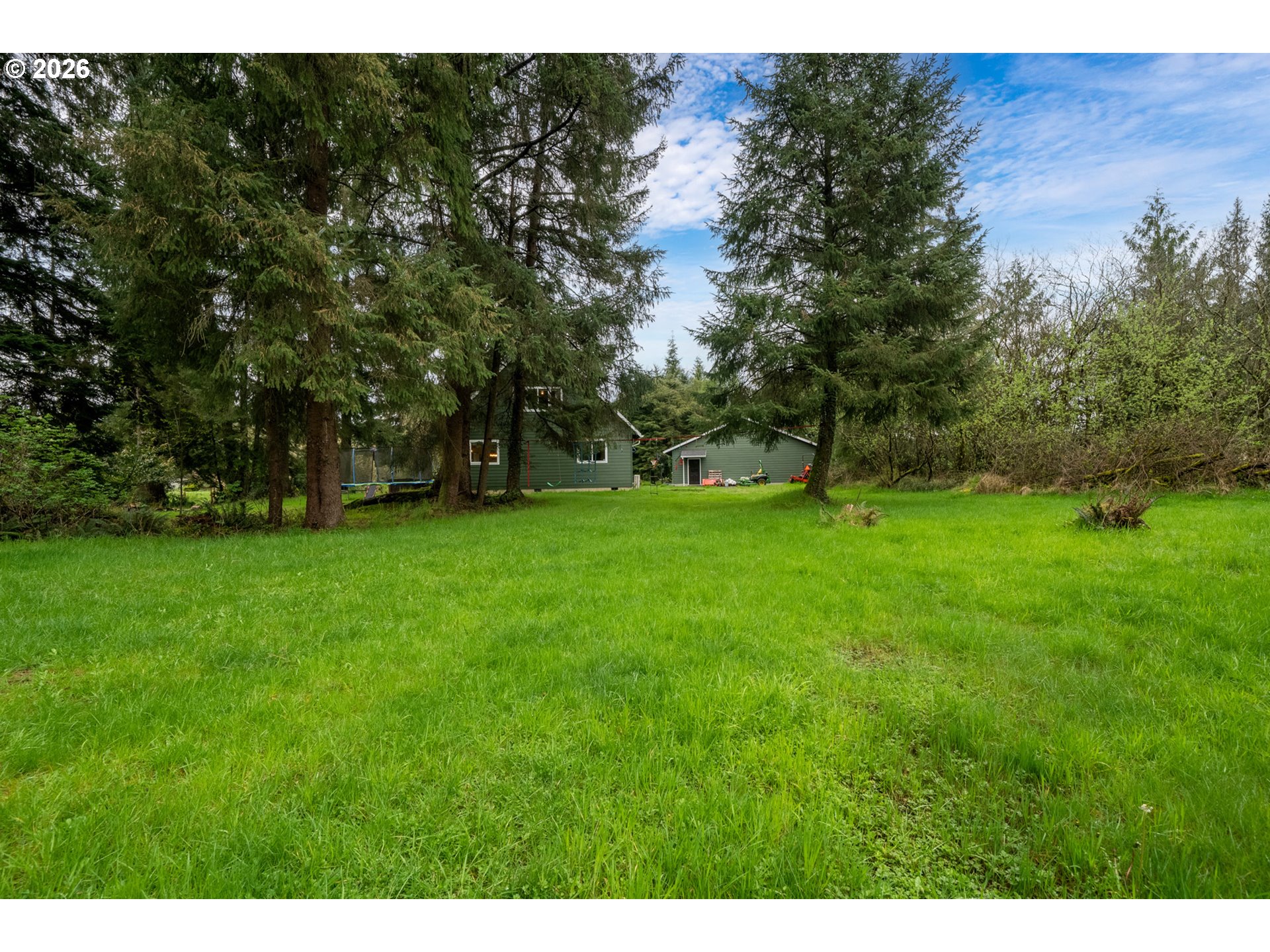 6040 Brickyard Road Tillamook, OR 97141 - Photo 37 of 41 a view of a field with trees in the background
