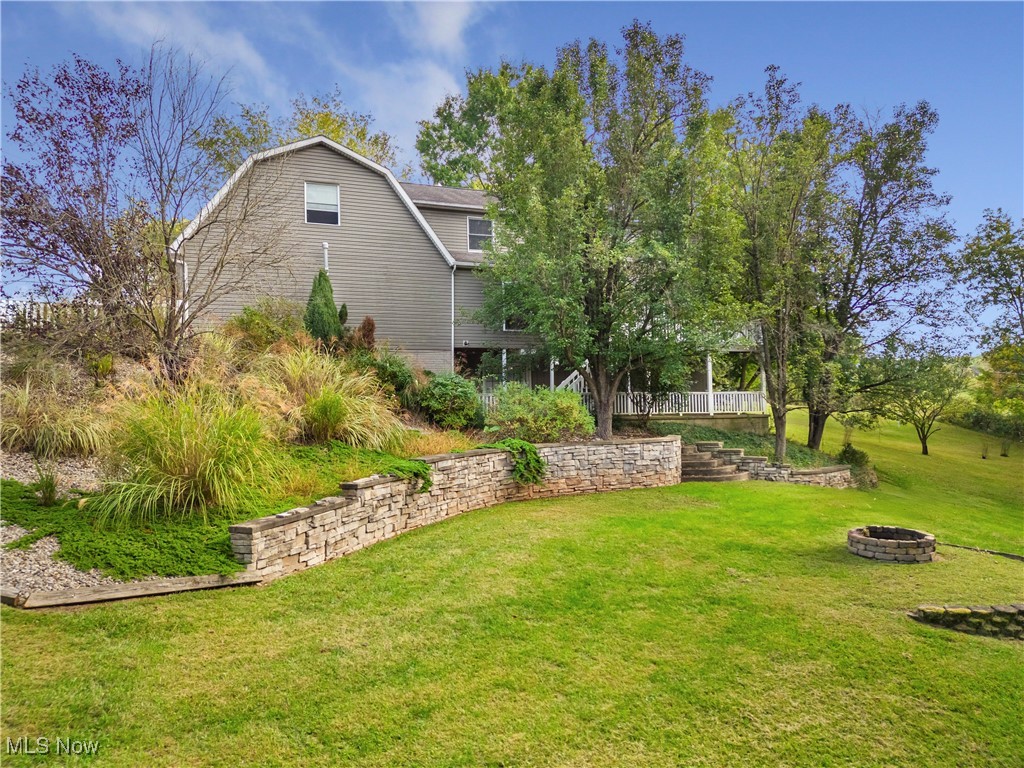 155 Ridgewood Boulevard Belpre, OH 45714 - Photo 12 of 49 View of grassy yard featuring a fire pit