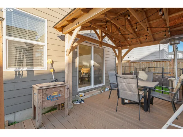 a view of a house with a backyard porch and sitting area