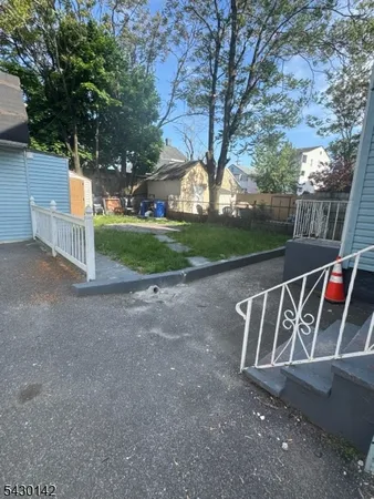 a view of backyard space and trees
