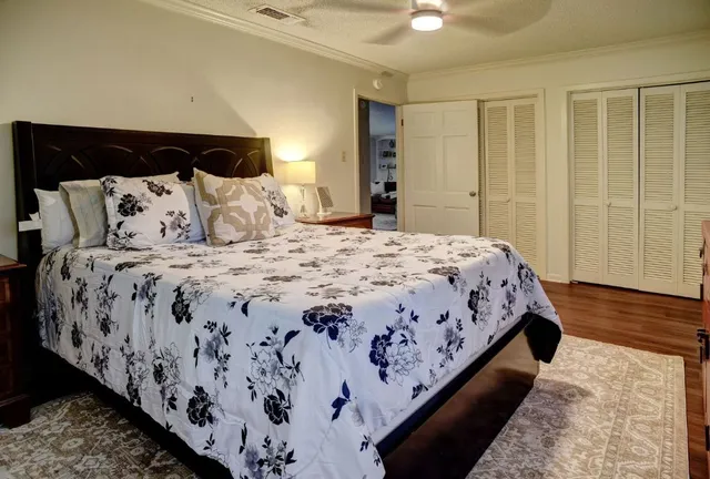 a bedroom with a bed and a dresser